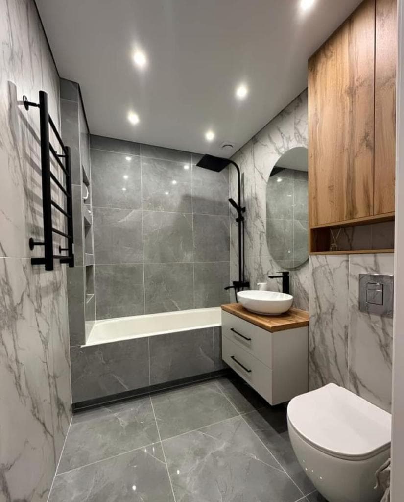 Master bathroom with soaking tub, modern wood vanity and matte black fixtures